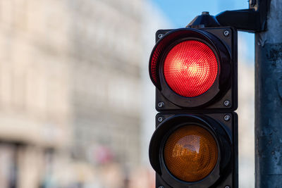 Close-up of road signal against blurred background