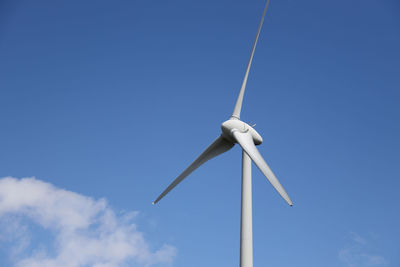 Low angle view of wind turbine against sky