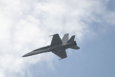 Low angle view of airplane flying in sky