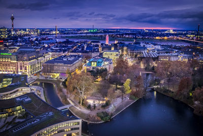 High angle view of illuminated buildings in city