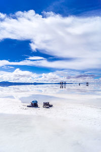 Scenic view of lake against cloudy sky during winter