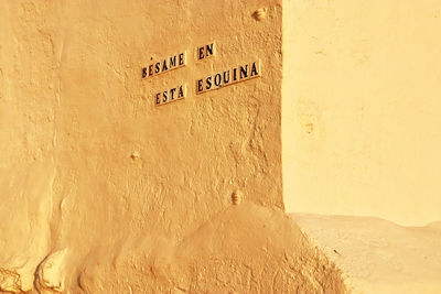 Close-up of text on wall