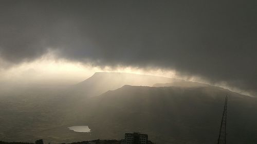 Low angle view of house against cloudy sky