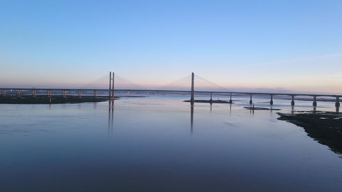 View of bridge over sea against clear sky