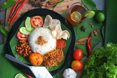 High angle view of fruits in plate on table