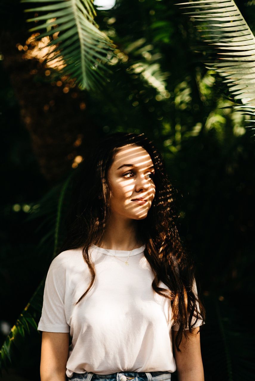 long hair, one person, happiness, focus on foreground, smiling, real people, front view, outdoors, tree, day, fun, leisure activity, young adult, cheerful, nature, young women, beautiful woman, people