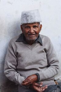 Portrait of smiling man sitting at home