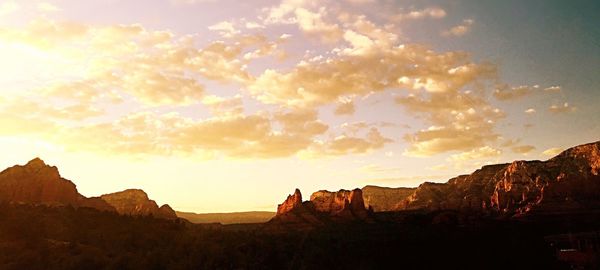 Scenic view of landscape against cloudy sky
