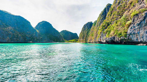 Panorama of famous phi phi island in thailand with sea, boats and mountains in beautiful lagoon