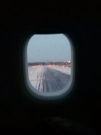 View of airplane wing seen through window