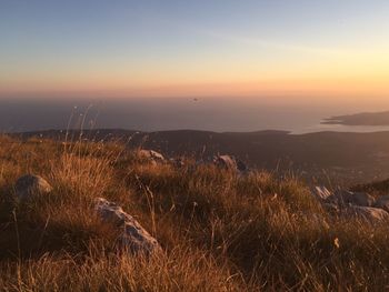 Scenic view of landscape against sky during sunset