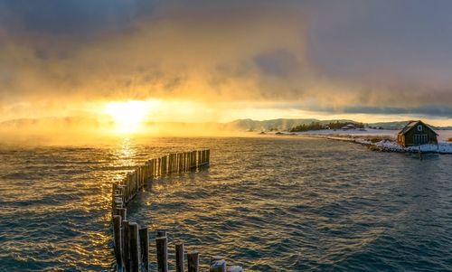 Scenic view of sea against sky during sunset