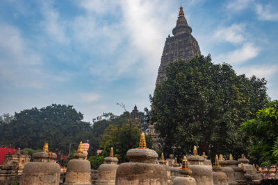 Buddhist stupas isolated with bright sky and unique prospective