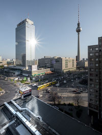 View of city street and buildings against sky