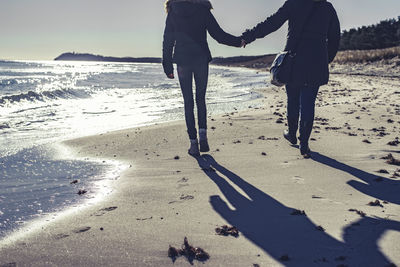 Low section of people on beach