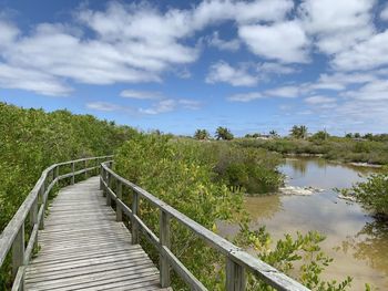 Footbridge over lake against sky on isabela island galapagos 
