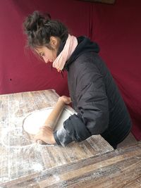 High angle view of woman sitting on floor