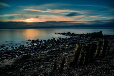 Scenic view of baltic sea against sky during sunrise