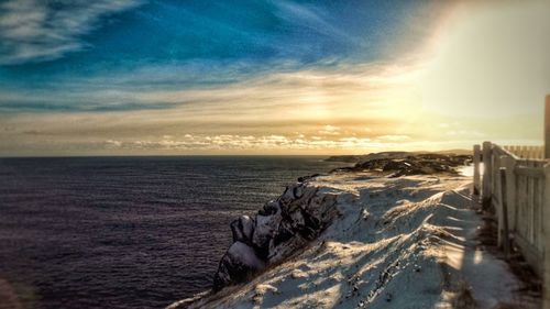 Scenic view of sea against sky during winter