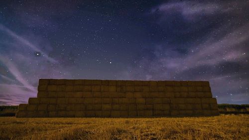 Scenic view of field against sky at night