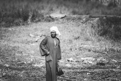 Farmer standing on field