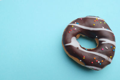 
chocolate  donuts on a blue background.