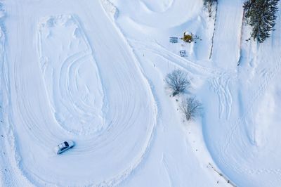 High angle view of car on snow covered land