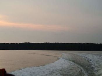 Scenic view of sea against sky at sunset