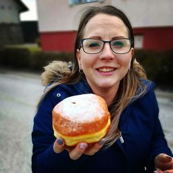 Portrait of young woman eating ice cream