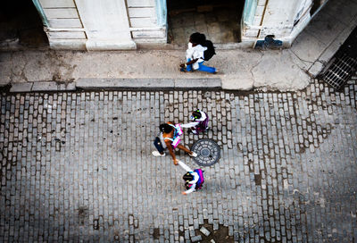 High angle view of people riding motorcycle