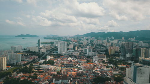 High angle view of buildings against sky in city