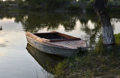 Boat moored on lake