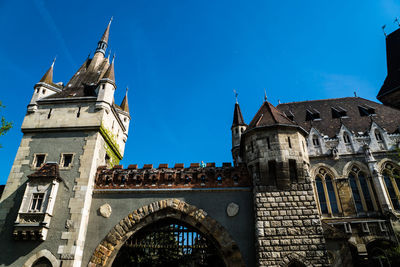 Low angle view of church against blue sky