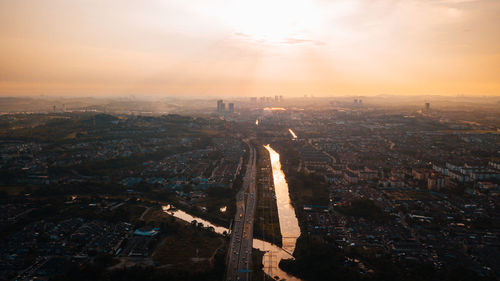 High angle view of cityscape against sky during sunset