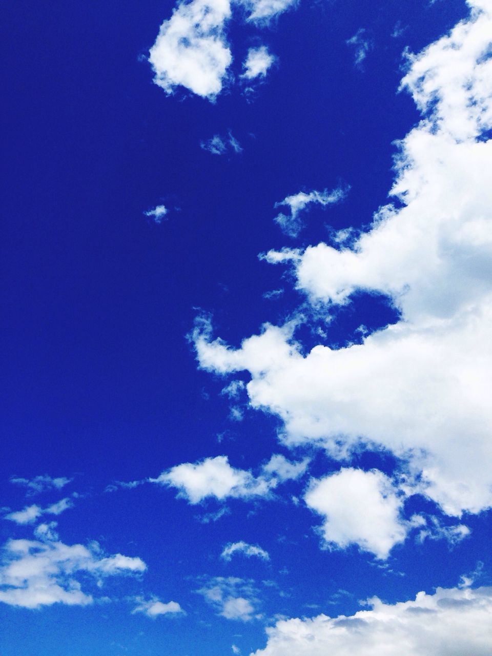 blue, low angle view, sky, sky only, beauty in nature, cloud - sky, tranquility, nature, scenics, tranquil scene, backgrounds, cloud, cloudscape, white color, full frame, idyllic, cloudy, day, outdoors, fluffy