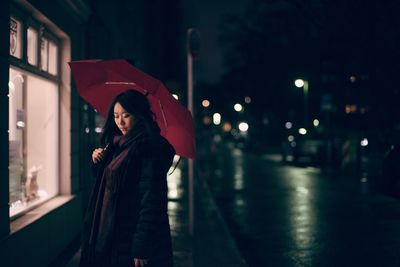 Woman standing at night
