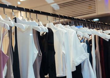 Clothes hanging on rack in store