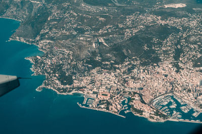 Aerial view of sea and cityscape