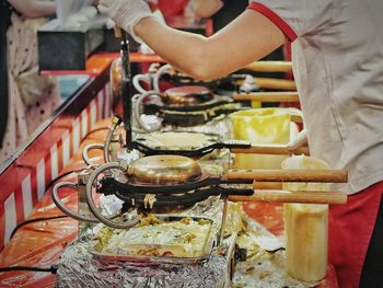 Close-up of man working on cutting board