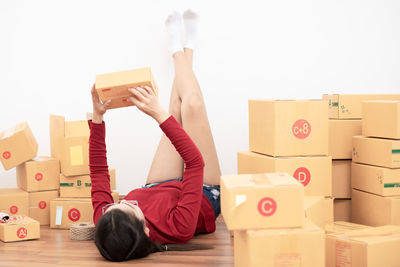 Rear view of boy playing with toy at home