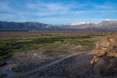 Owens river valley cliff view distant snowy peaks of eastern sierra nevada mountains california usa