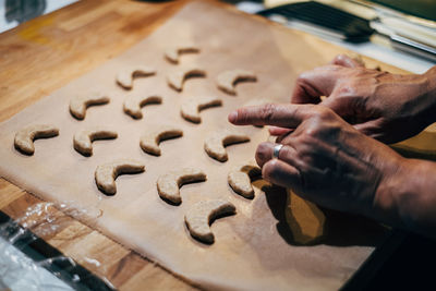 Midsection of person preparing cookies