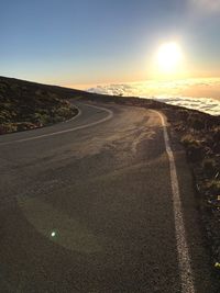 Aerial view of road against sky during sunset