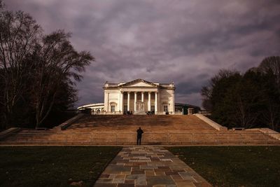 Rear view of building against cloudy sky