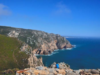 Scenic view of sea against clear blue sky