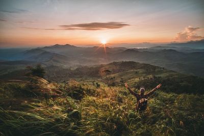 Scenic view of mountain against cloudy sky