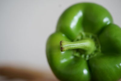 Close-up of green chili peppers on table