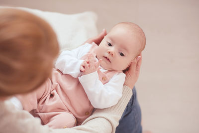 Midsection of mother with daughter