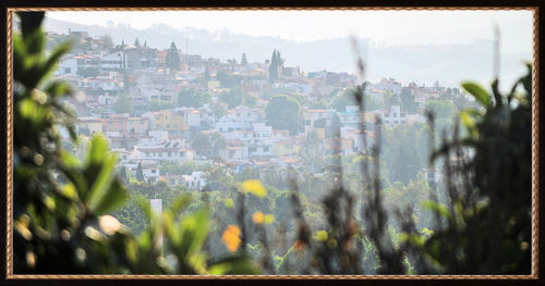 View of cityscape through window