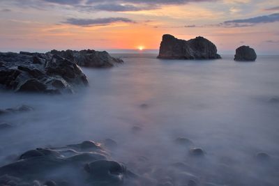 Scenic view of sea against sky during sunset